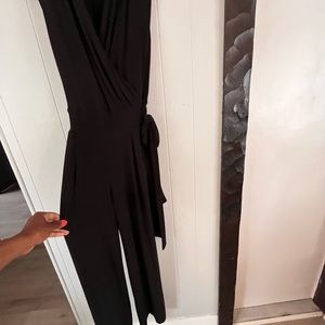 New York and Company black one piece jumper with belt.